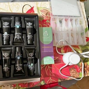 Gel nail extension kit. Includes the gel, the forms, and the light.